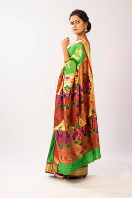 Green hand woven silk blend saree with blouse 2