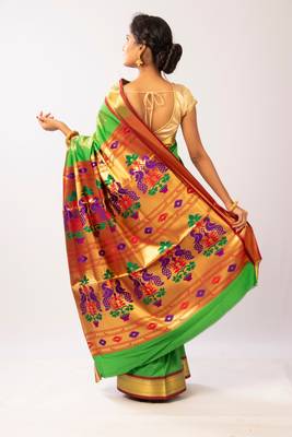 Green hand woven silk blend saree with blouse 3