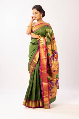 Green hand woven silk blend saree with blouse 1