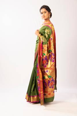 Green hand woven silk blend saree with blouse 3
