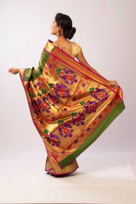 Green hand woven silk blend saree with blouse 4