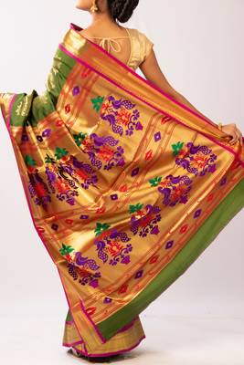 Green hand woven silk blend saree with blouse 5