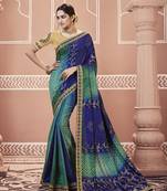 Blue embroidered georgette saree with blouse