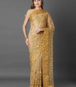Beige embroidered net saree with blouse