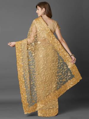 Beige embroidered net saree with blouse 4