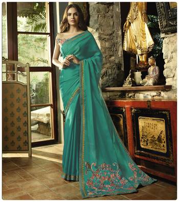 Turquoise embroidered georgette saree with blouse 1