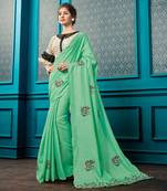 Green Embroidered Faux Georgette Saree With Blouse