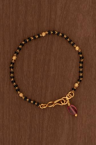 Black beads bracelet with ruby bead hanging one gram gold