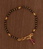 Black beads bracelet with ruby bead hanging one gram gold