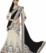 Cream embroidered net semi stitched lehenga
