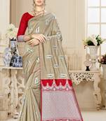 Cream woven banarasi saree with blouse