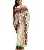 Cream embroidered net saree with blouse