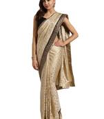 Beige embroidered poly silk saree with blouse