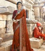 Dark orange embroidered georgette saree with blouse