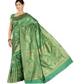 Green woven banarasi saree with blouse