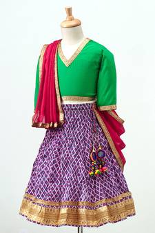 Purple printed Lehenga with contrast green tie back choli and Pink Dupatta