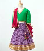 Purple printed Lehenga with contrast green tie back choli and Pink Dupatta