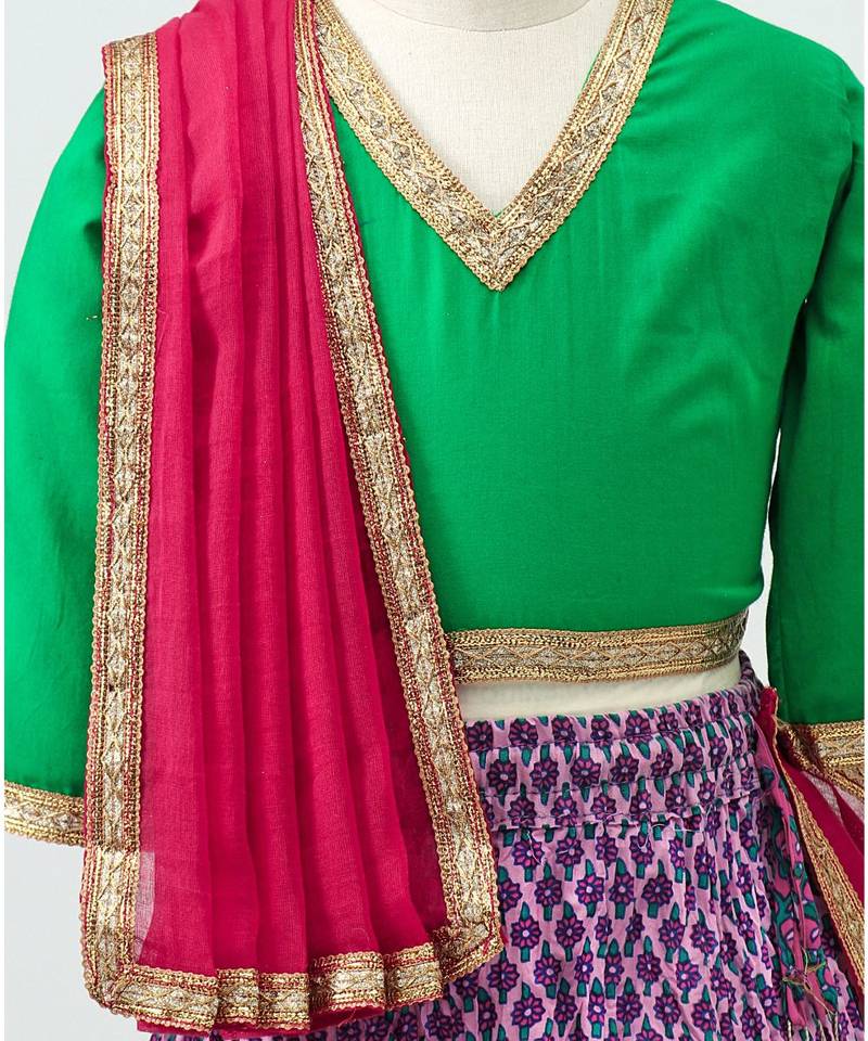Purple printed Lehenga with contrast green tie back choli and Pink Dupatta