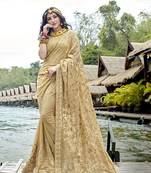 Beige embroidered georgette saree with blouse