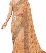 Beige embroidered net saree with blouse