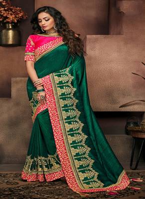   dark green embroidered fancy fabric saree with blouse 1