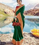   dark green embroidered silk blend saree with blouse