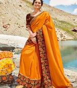 Orange embroidered silk blend saree with blouse