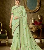 Light green embroidered organza saree with blouse