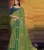 Green embroidered silk blend saree with blouse