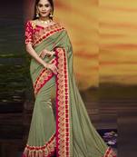 Green embroidered silk blend saree with blouse