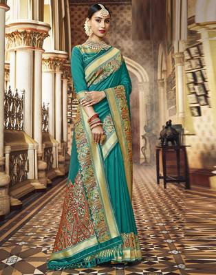Green woven silk blend saree with blouse 1