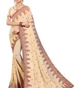 Cream embroidered georgette saree with blouse