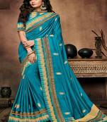 Teal embroidered satin saree with blouse