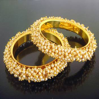 Gold pearl bangles and bracelets 1