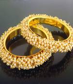 Gold pearl bangles and bracelets