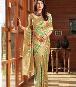 Cream woven banarasi silk saree with blouse