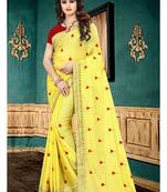 Yellow embroidered georgette saree with blouse