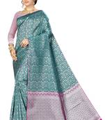 Dark green woven banarasi saree with blouse