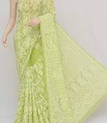 green embroidered faux georgette saree with blouse