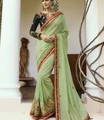 Light green embroidered silk saree with blouse