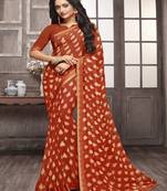 Rust printed georgette saree with blouse