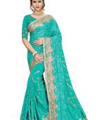 Turquoise embroidered georgette saree with blouse