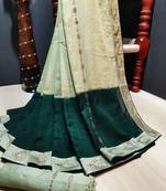 Green woven silk blend saree with blouse
