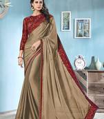 Beige embroidered chiffon saree with blouse