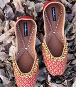 Red woven leather juttis