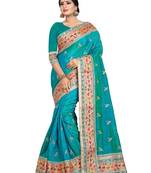 Turquoise embroidered art silk saree with blouse