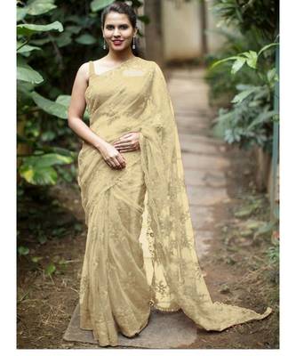 Cream woven net saree with blouse 1