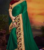 Dark green embroidered satin saree with blouse