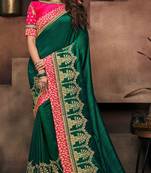 Dark green embroidered satin saree with blouse