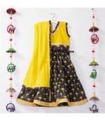 Printed Black Lehenga With A Yellow Tie Back Crop Top And Yellow Lehenga